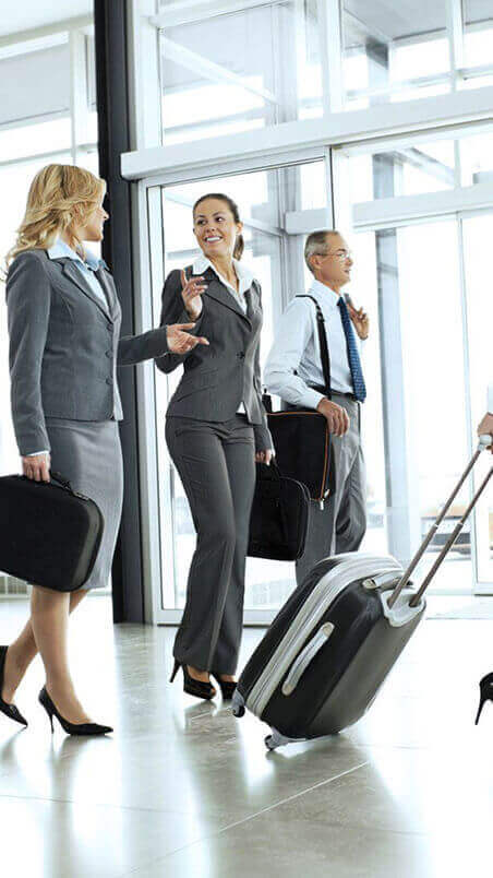 business-travelers-walking-through-airport-terminal
